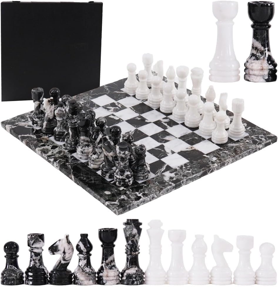Black and white chess set with pieces and board on a white background