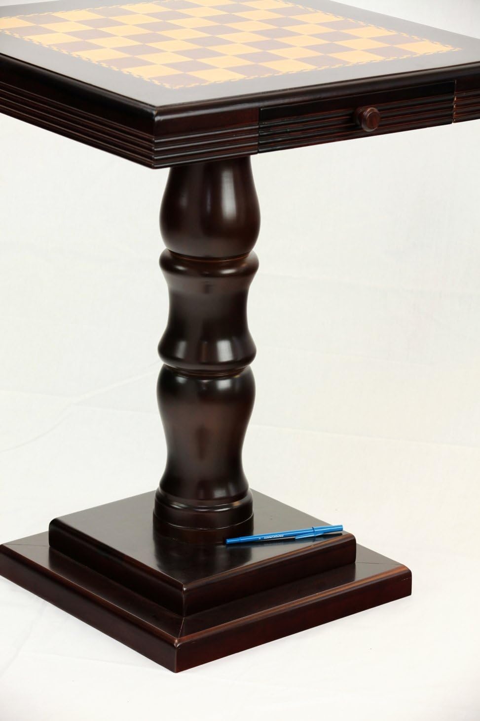 Wooden chess table with checkered surface on a white background