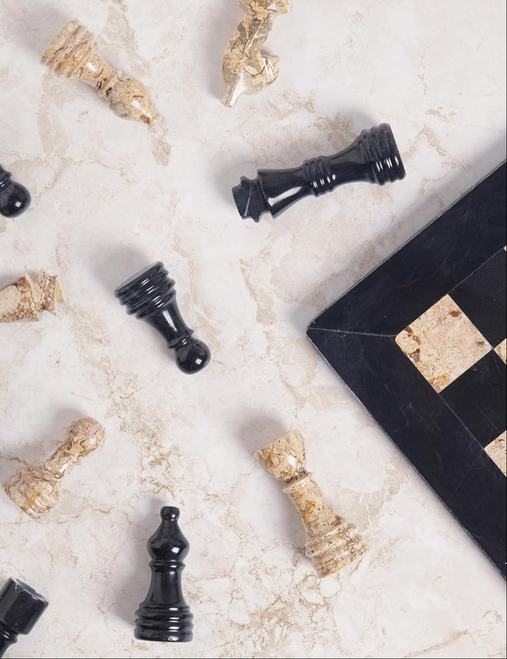 Decorative chess pieces on a marble surface