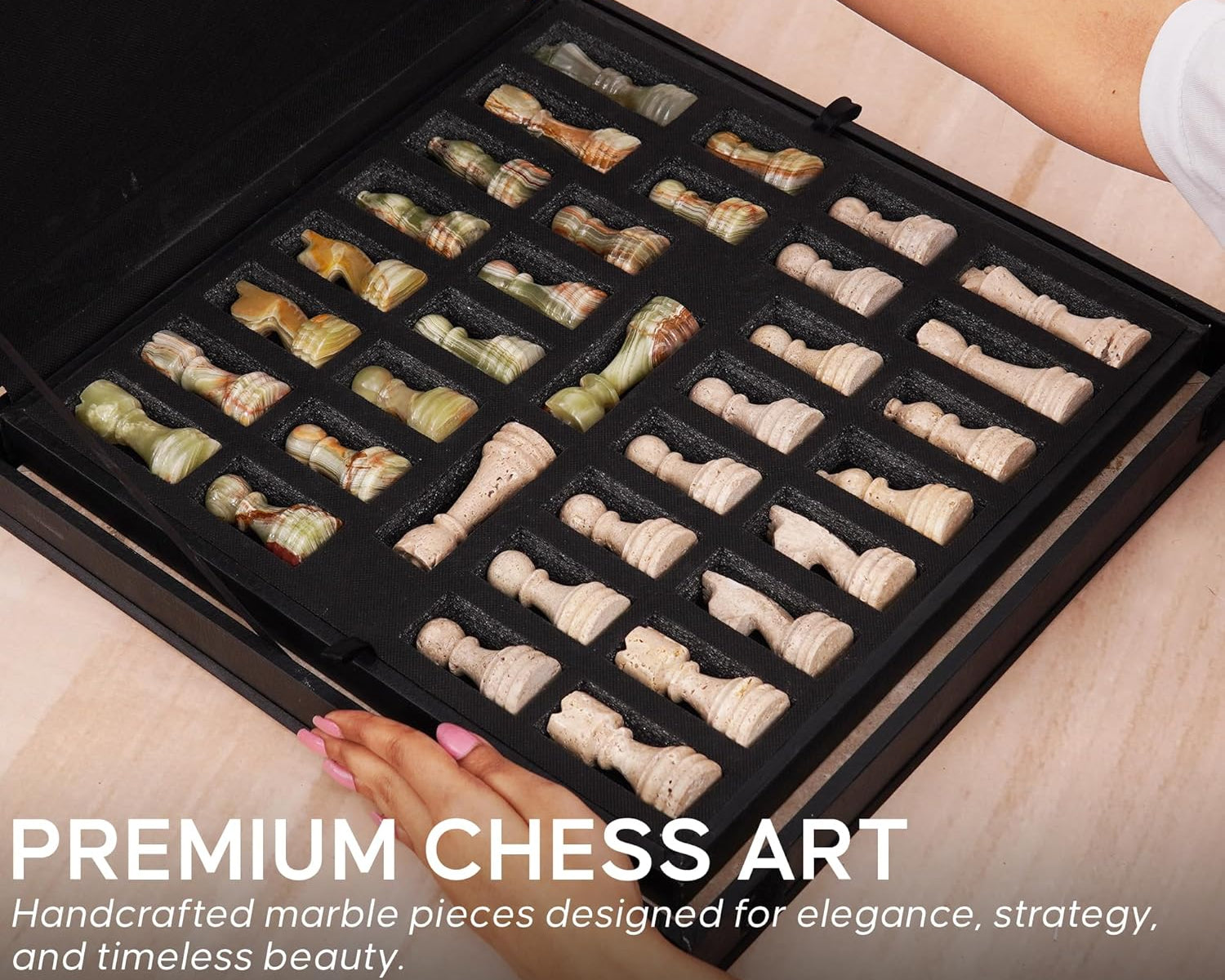 Set of handcrafted marble chess pieces in a black storage case 