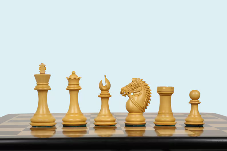 Set of Staunton wooden chess pieces on a chessboard 